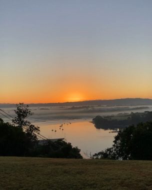 exercise | FAP News Today | Jaime snaps a photo of the sun rising over the water in New Zealand during one of her early-morning runs.