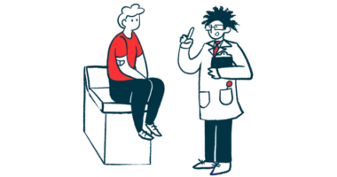 A doctor holds a clipboard and gestures while talking to a patient seated on an examining table.